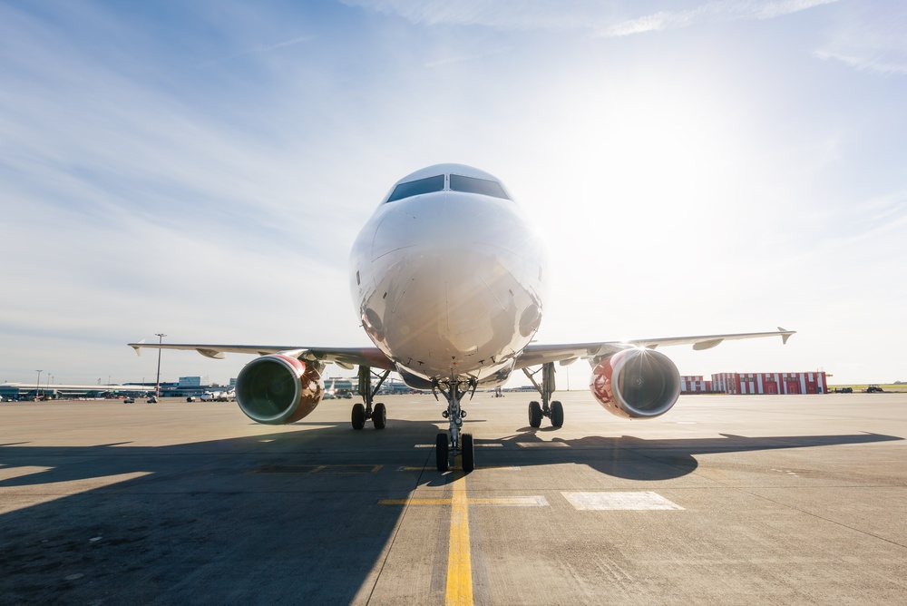 Front,View,Of,Airplane,Taxiing,Toward,Airport,Runway,On,Sunny