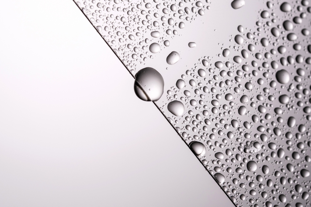 Drops,Of,Water,On,A,Transparent,Gray,Background.