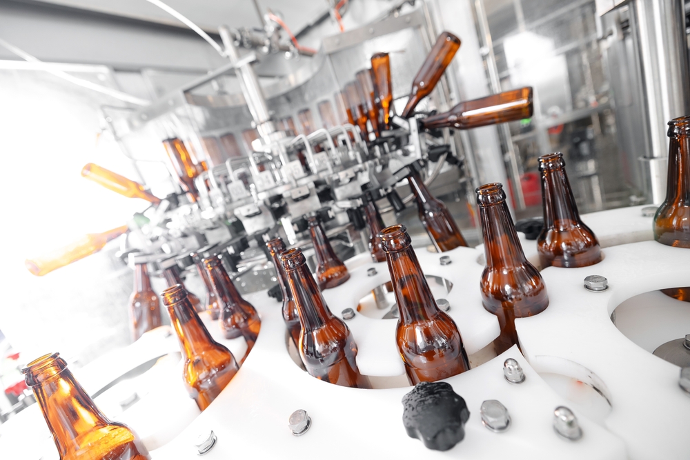 Process,Pasteurization,Brown,Glasses,Bottles,With,Beer,,Moving,On,Conveyor.